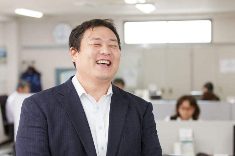 代表取締役社長松村和俊の笑顔